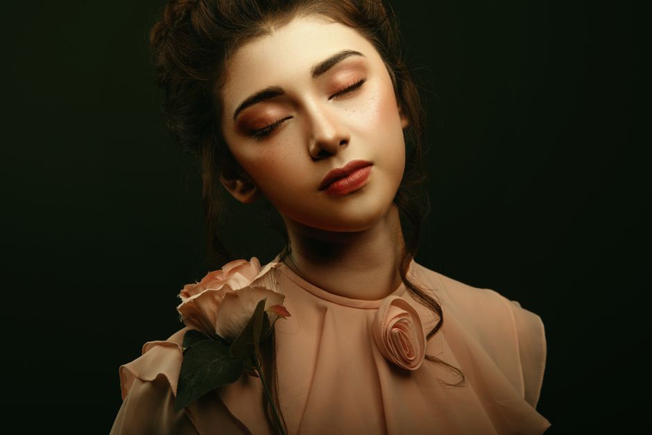 Portrait of an elegant woman with eyes closed, wearing a rose, Ciudad de Guatemala.