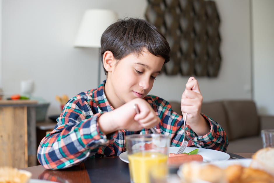 A young boy having breakfast at home in a cozy setting, showcasing daily routine and etiquette.